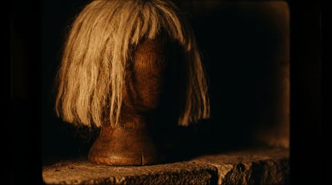 Pale-yellow wig on stand